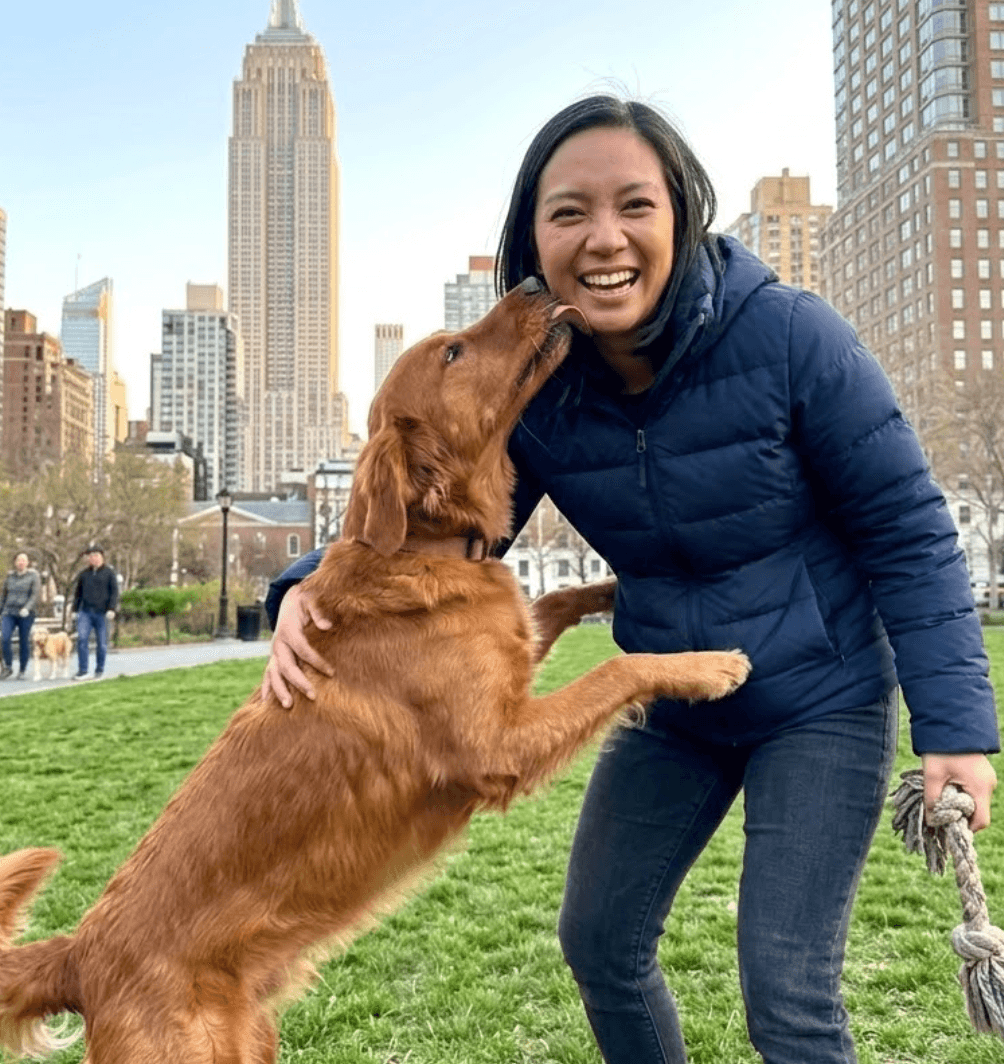 Profile photo of woman with dog in park